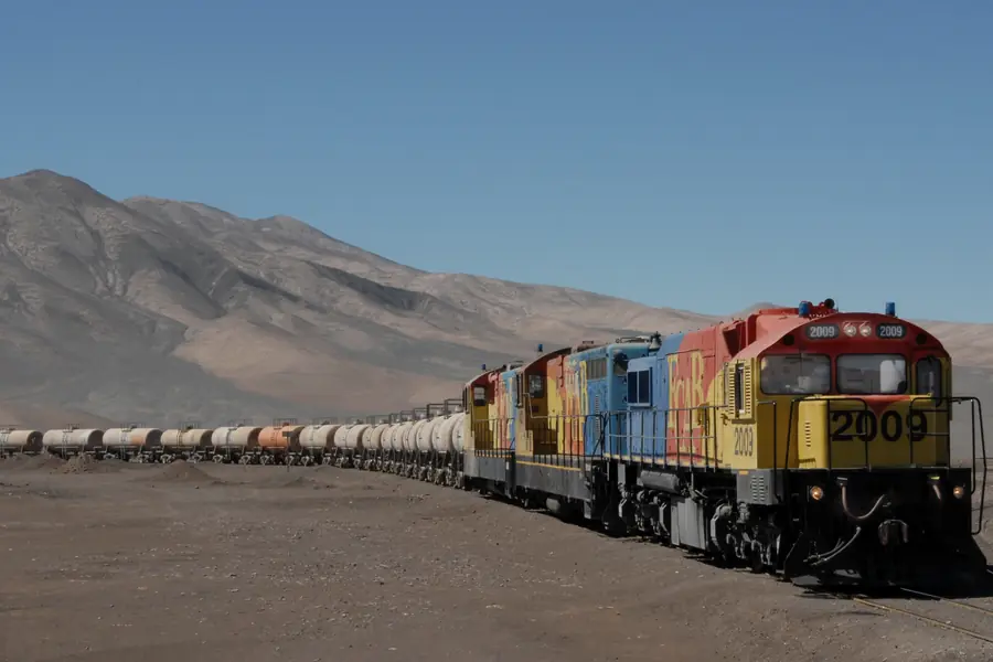Freight train crossing the Andean desert toward the Pacific coast